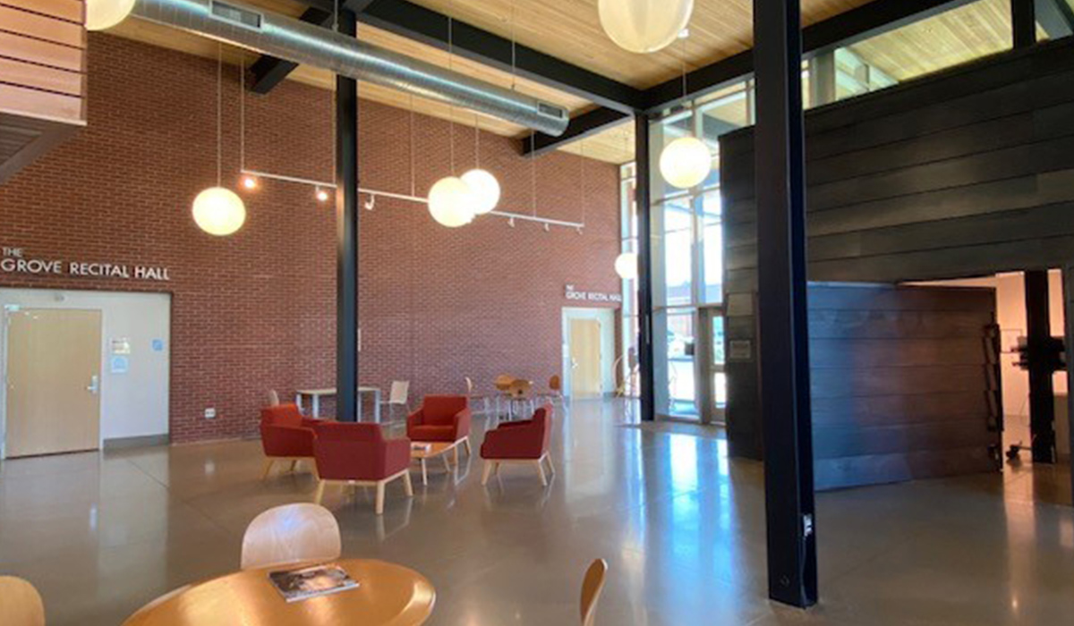 The lobby in the Music and Art Center, with seating areas, the MAC Gallery, and entrances to the recital hall.