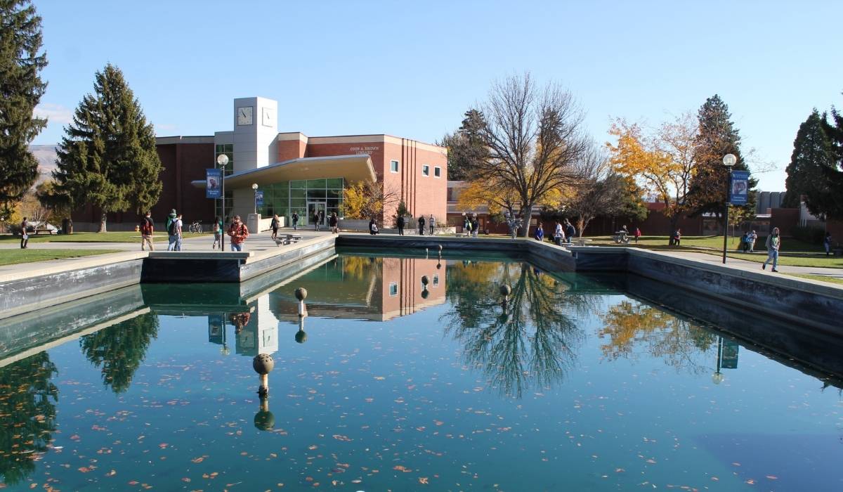 Photo of WVC Fountain with still water and Brown Library in background