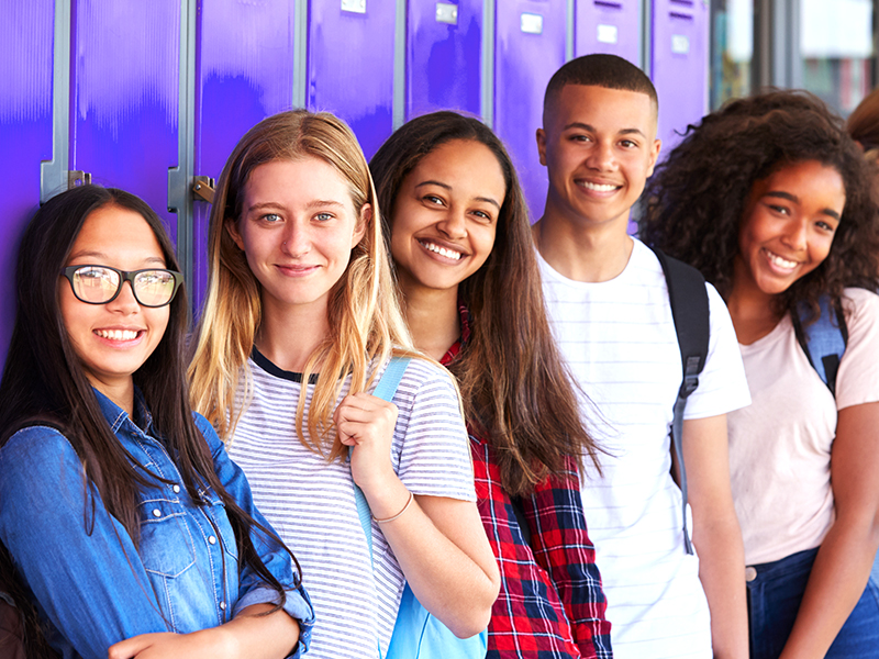 High School students by locker.