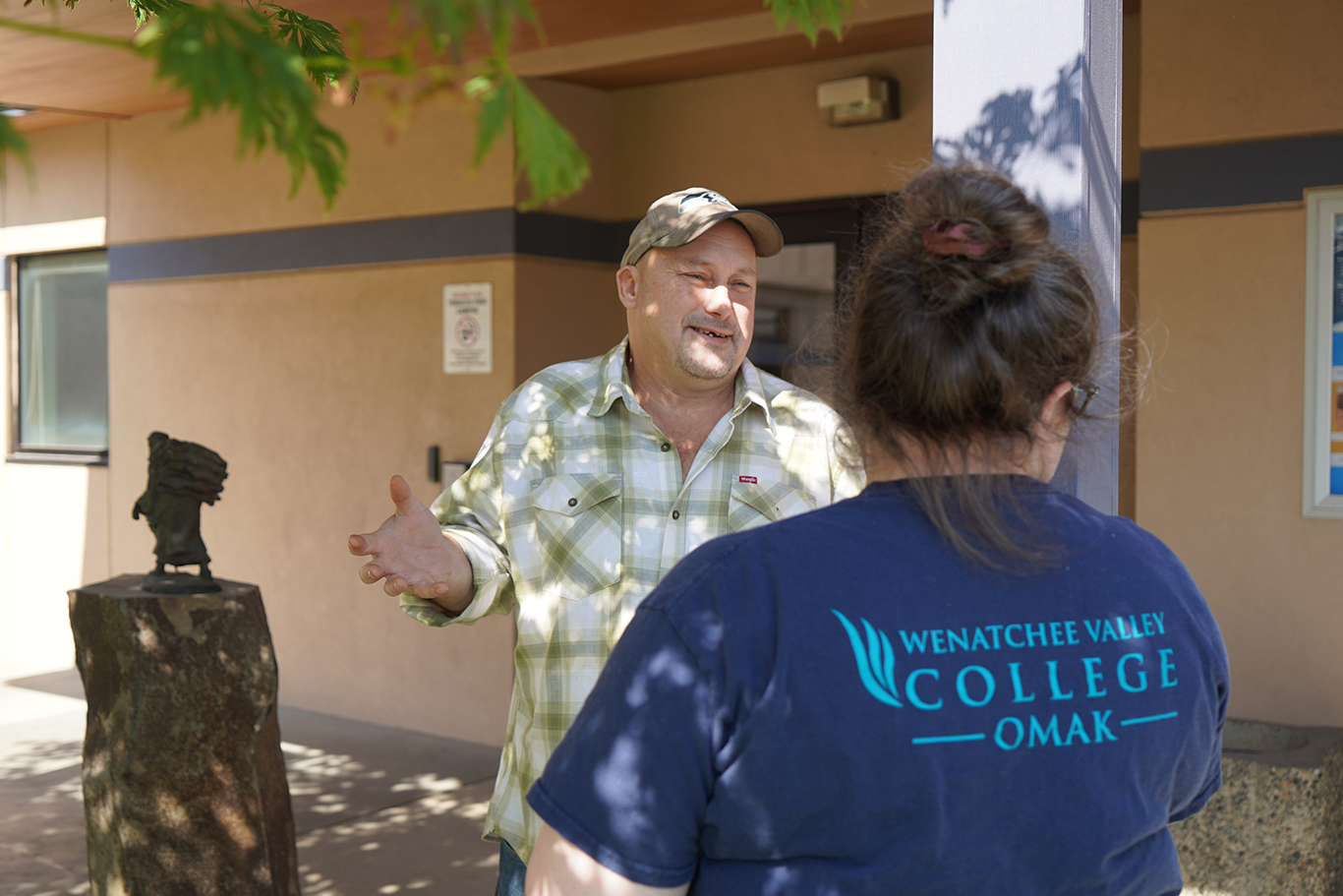 Student interacting with faculty member
