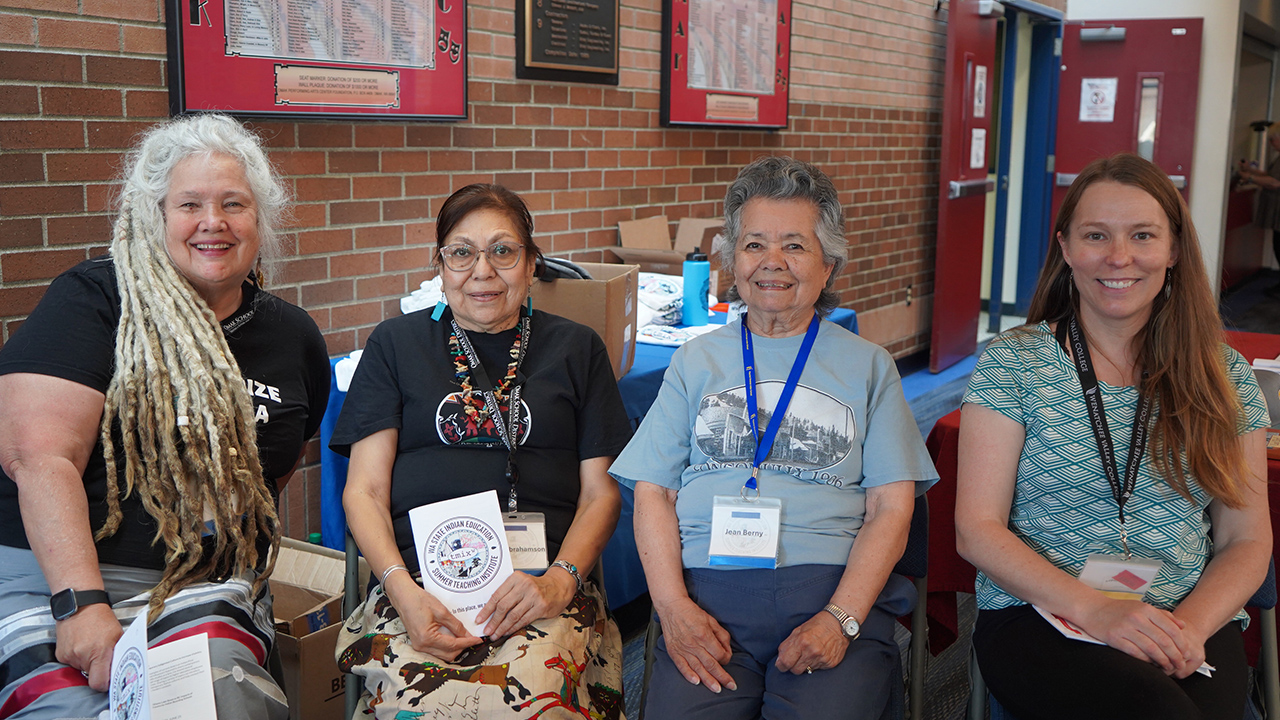 Four presenters from the 2025 Indian Education Summer Teaching Institute sit together.