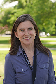 Portrait of Jennifer Hadersberger standing outside