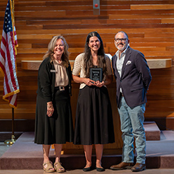 Graduate Kara Flaherty stands with Dr. Jennifer Freese and Dr. Tod Treat at the LPN convocation.