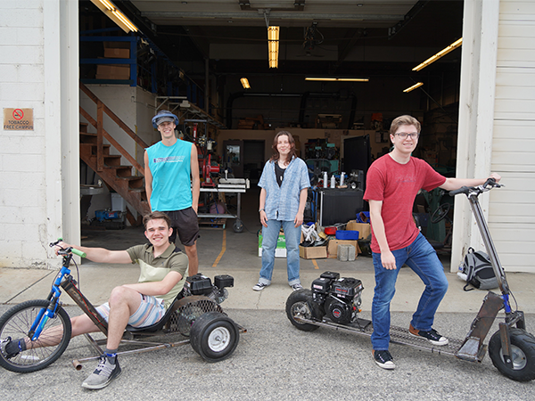 Four WVC Mechatronics Club members with their go-karts