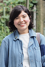 Portrait of Marcine Miller standing outside and smiling at the camera